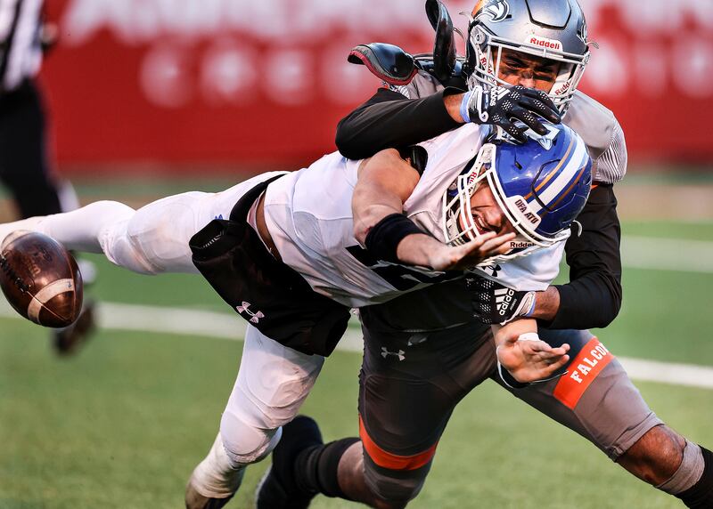 Bingham’s QB Dallen Martinez is sacked by Skyridge’s Tausili Akana.