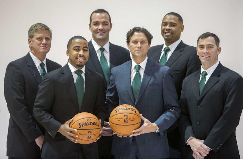 The Utah Jazz coaching staff, front row, Johnnie Bryant, Quin Snyder, Mike Wells, back row, Brad Jones, Alex Jensen, Antonio Lang pose for photos as the Utah Jazz hold their media day Monday, Sept. 29, 2014, in Salt Lake City at the Zions Bank basketball