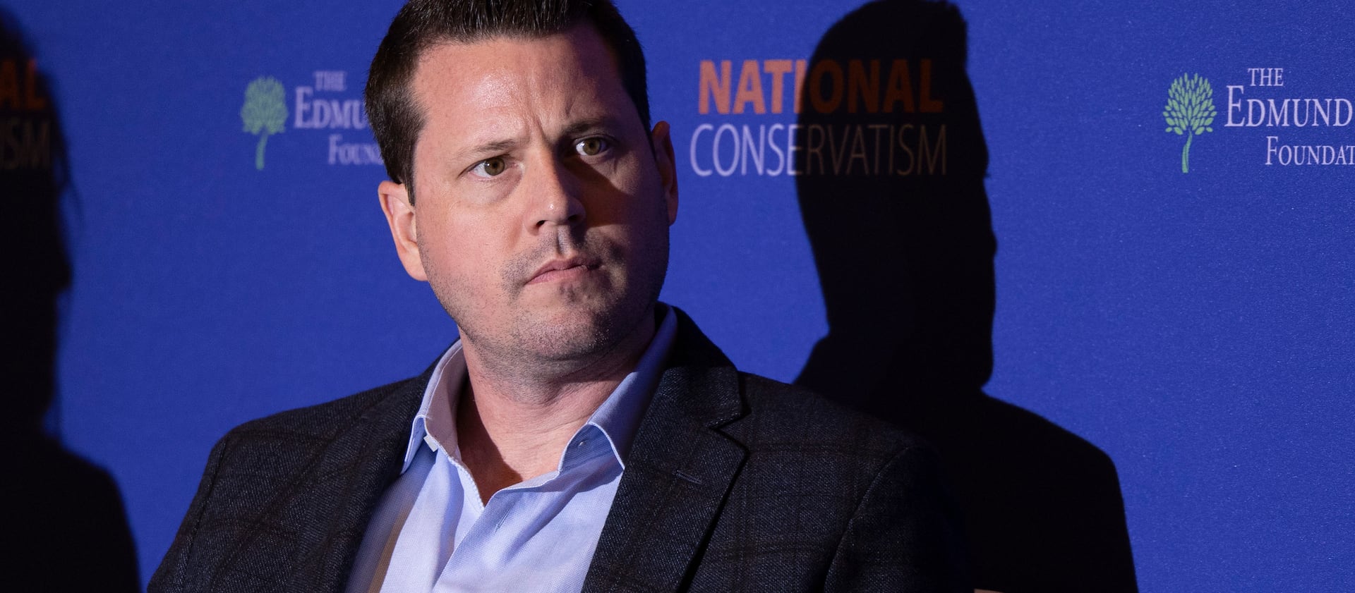 Seth Dillon, CEO of The Babylon Bee, waits to speak on a panel at the National Conservatism Conference.