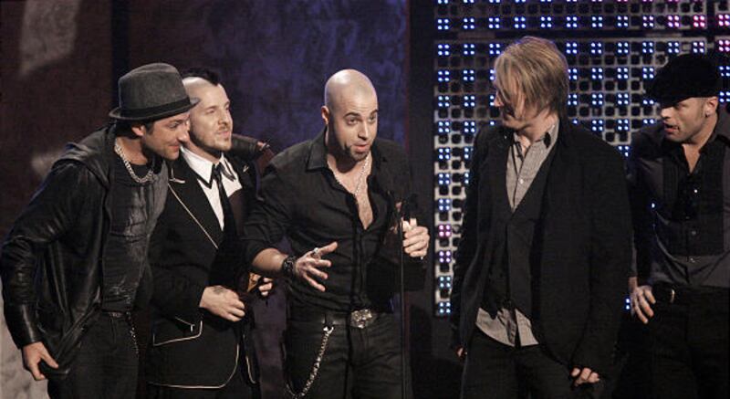 Chris Daughtry and his band accept the breakthrough artist award Sunday at the American Music Awards. Daughtry also was named favorite adult contemporary artist. Justin Timberlake was named favorite pop-rock artist.