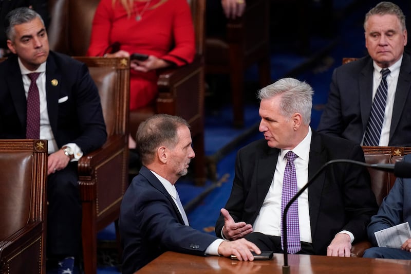 Rep. Chris Stewart, R-Utah, talks with Rep. Kevin McCarthy, R-Calif., in the House chamber as the House meets for a second day to elect a speaker and convene the 118th Congress in Washington, Wednesday, Jan. 4, 2023.