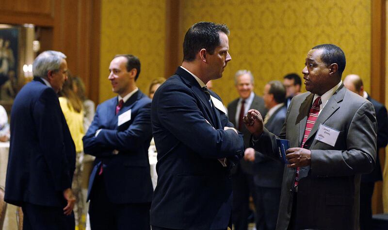 FILE — Rep. Jacob Anderegg, R-Lehi, left front, and James Evans talk before a press conference in Salt Lake City, Tuesday, May 12, 2015. After two Republican candidates for state Senate District 13 suspended their campaigns Tuesday, it appeared Anderegg w