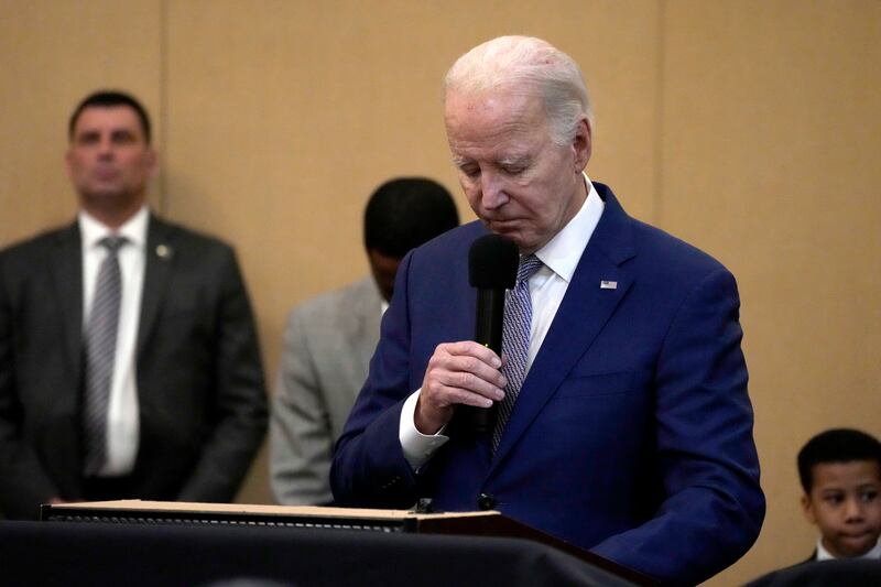 President Joe Biden bows his head in a moment of silence for the three American troops killed on Sunday, Jan. 28, 2024.
