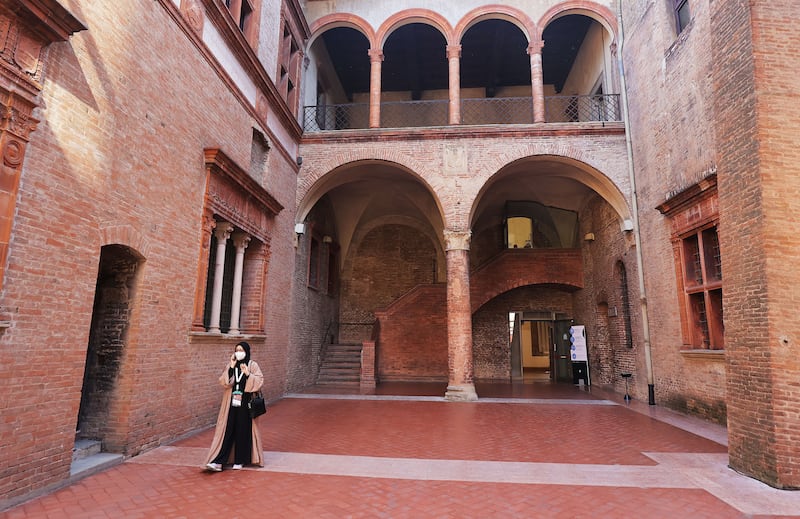 An attendee walks through the Palazzo Re Enzo during the G20 Interfaith Forum in Bologna, Italy on Monday, Sept. 13, 2021.