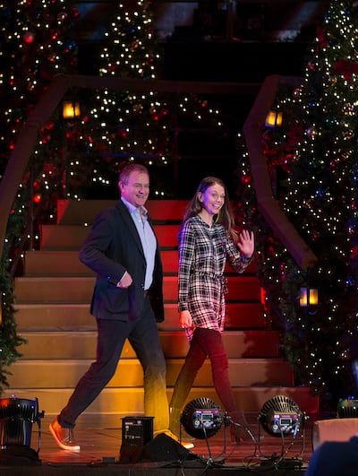 Hugh Bonneville and Sutton Foster walk across stage for a press conference discussing the Mormon Tabernacle Choir and Orchestra Christmas concert at The Church of Jesus Christ of Latter-day Saints Conference Center in Salt Lake City on Friday, Dec. 15, 20
