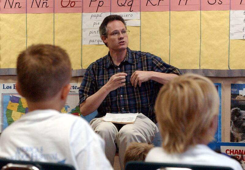 Jeff Gomm speaks with students during a summer language camp at Timpanogos Elementary in Provo on June 27, 2002.