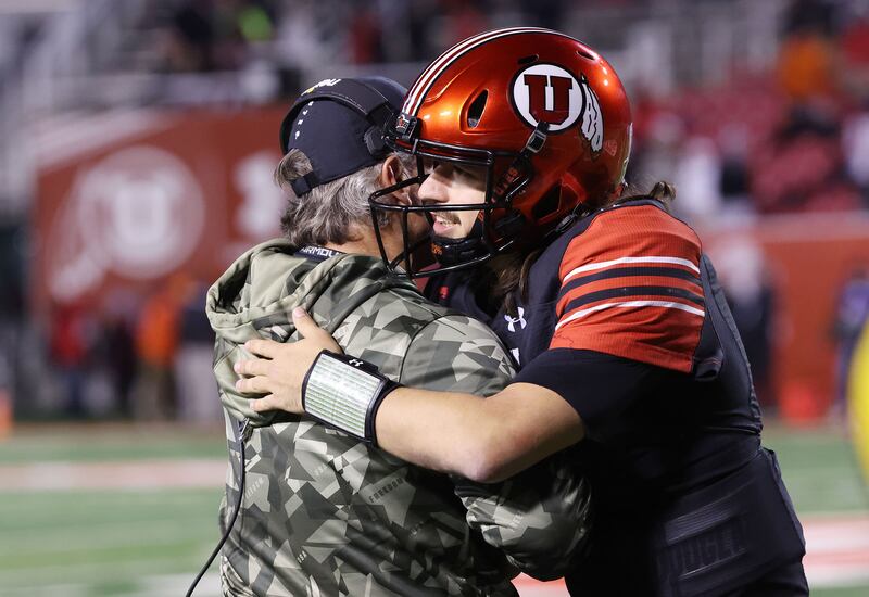 Utah Utes quarterback Cam Rising (7) hugs coach Kyle Whittingham at the end of the game against Stanford on Nov. 12, 2022.
