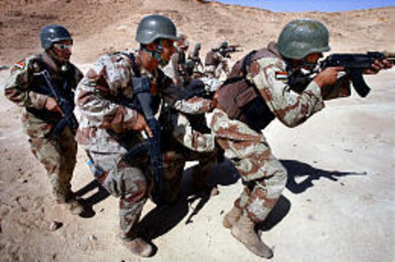 U.S. Marine Corps photo shows Iraqi soldiers practicing combat firing techniques at Camp al-Asad in Ramadi on Sunday.