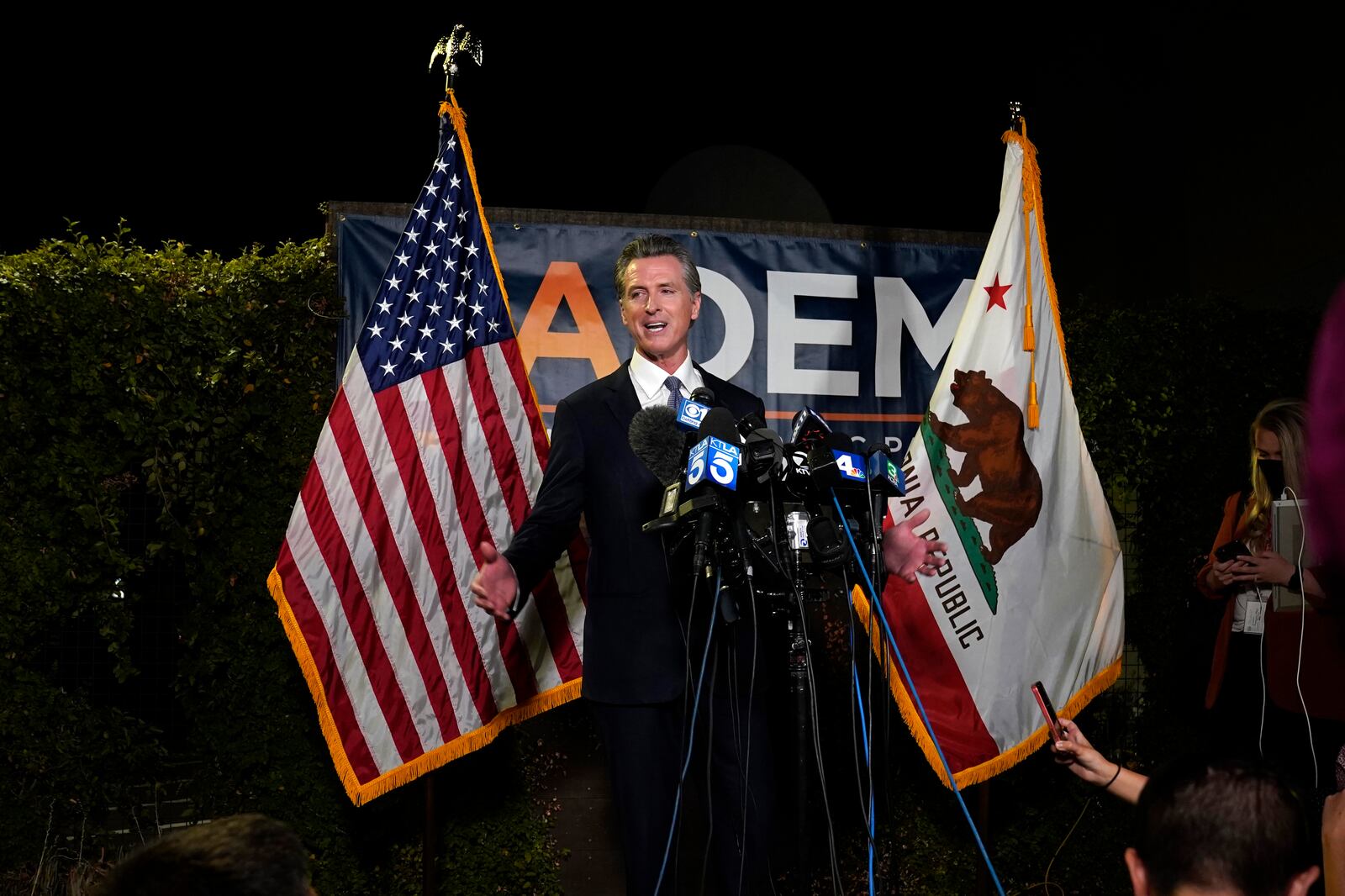 California Gov. Gavin Newsom talks to reporters after winning the recall election Tuesday.