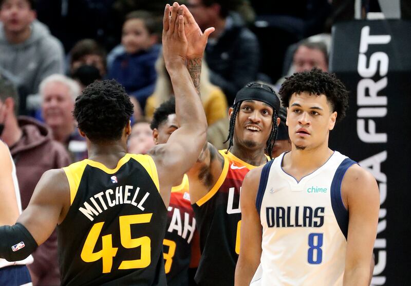 Utah Jazz guards Donovan Mitchell and Jordan Clarkson high-five each other during game vs. Dallas in Salt Lake City.