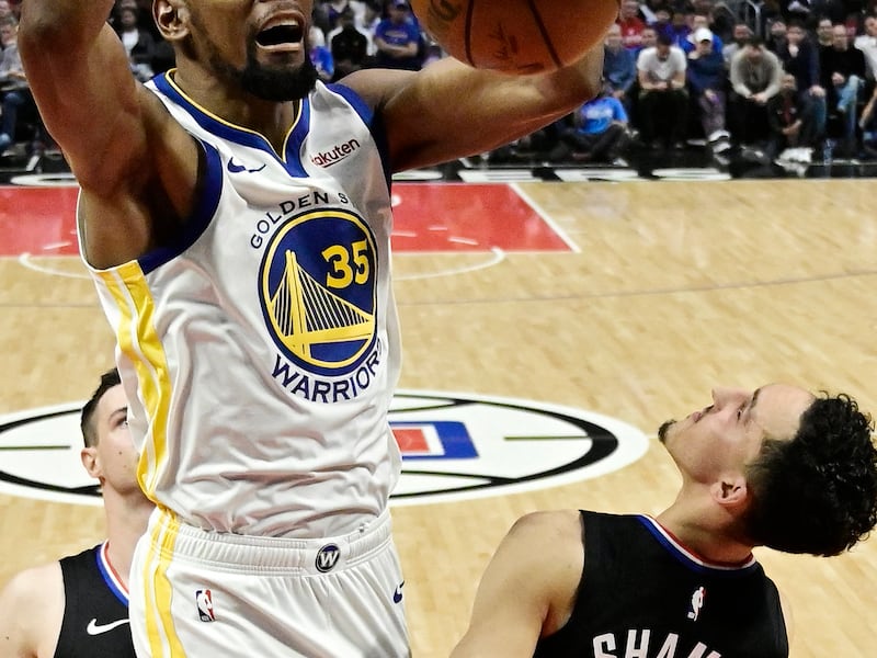FILE - In this April 21, 2019, file photo, Golden State Warriors forward Kevin Durant, top, dunks as Los Angeles Clippers guard Landry Shamet defends during the second half in Game 4 of a first-round NBA basketball playoff series in Los Angeles. Rarely re