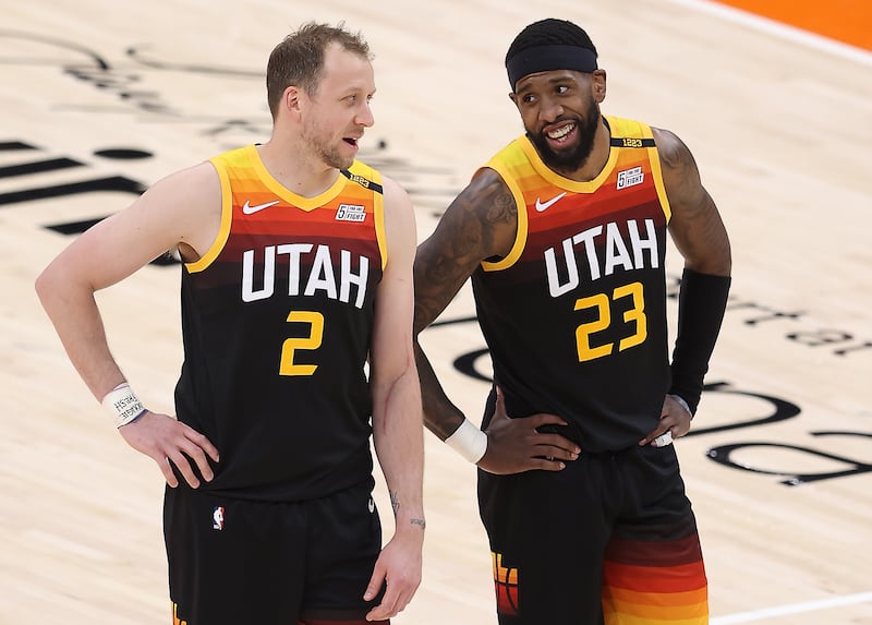Utah Jazz guard Joe Ingles, left, and Royce O’Neale talk during free throw as the Jazz and Cleveland play in Salt Lake City.