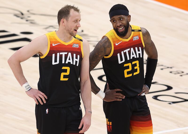 Utah Jazz guard Joe Ingles, left, and Royce O’Neale talk during free throw as the Jazz and Cleveland play in Salt Lake City.