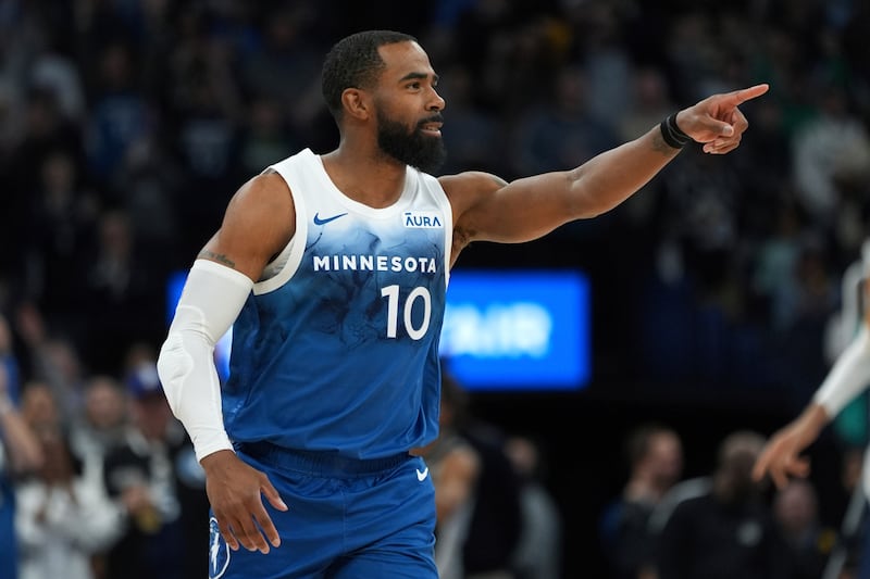 Minnesota Timberwolves guard Mike Conley points after making a basket during game against the San Antonio Spurs, Tuesday, Feb. 27, 2024, in Minneapolis.
