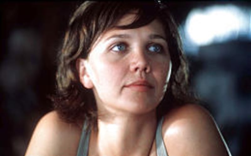 Maggie Gyllenhaal plays Jennifer, one of several women at hotel in Latin America hoping to adopt a baby in movie "Casa de los Babys."