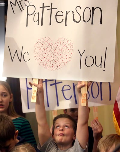 Jack Palfreyman holds up a sign in support of his teacher, Valley View Elementary School teacher Moana Patterson, during a press conference at the Capitol in Salt Lake City on Monday, March 11, 2019, about what Patterson says was a misunderstanding with a