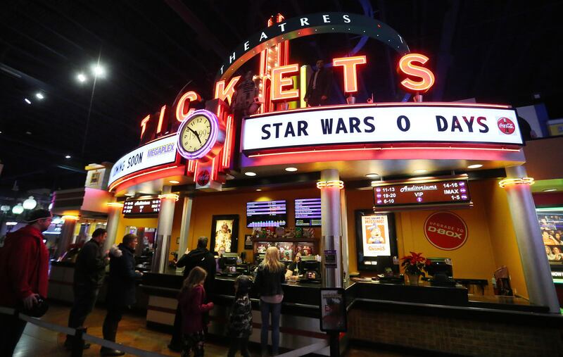 FILE - Tickets are purchased during a Star Wars: The Last Jedi premiere at the Megaplex theaters in Sandy on Thursday, Dec. 14, 2017.
