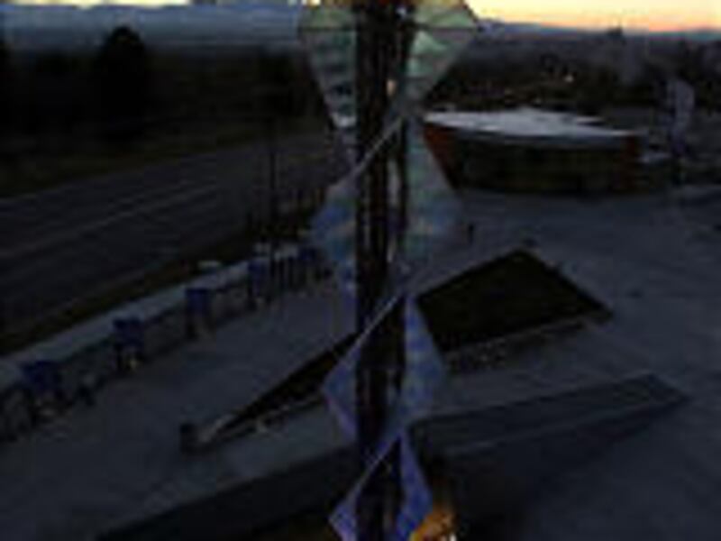 Olympic flame erupts again from the gas-powered, water-cooled cauldron at Rice-Eccles Stadium.