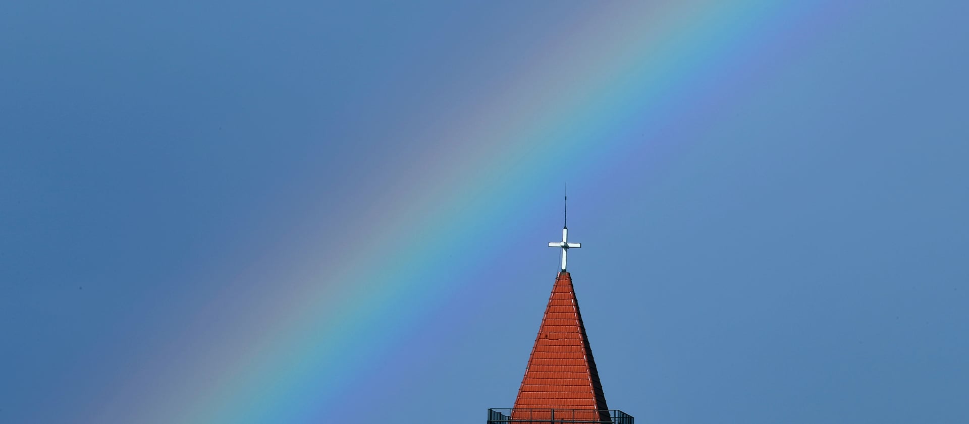 A rainbow appears over a church in downtown Beirut, Lebanon, Monday, Jan. 20, 2020.