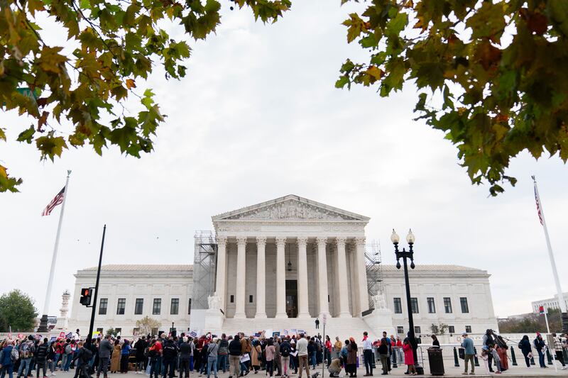 Gun safety and domestic violence prevention organizations gather outside of the Supreme Court on Nov. 7, 2023.