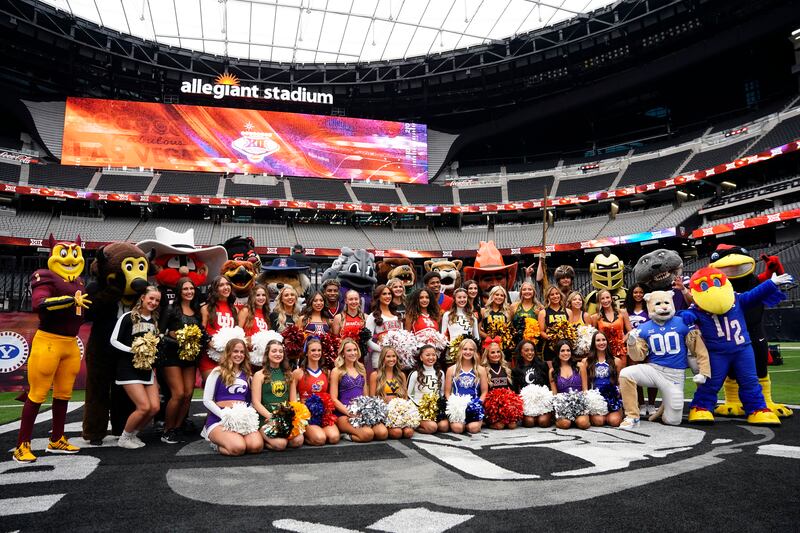 Mascots and cheerleaders from the 16 Big 12 schools pose for a group photo during Big 12 NCAA college football media days in Las Vegas, Wednesday, July 10, 2024. The 16 coaches offered a bit more substance about their teams heading into 2024 season.