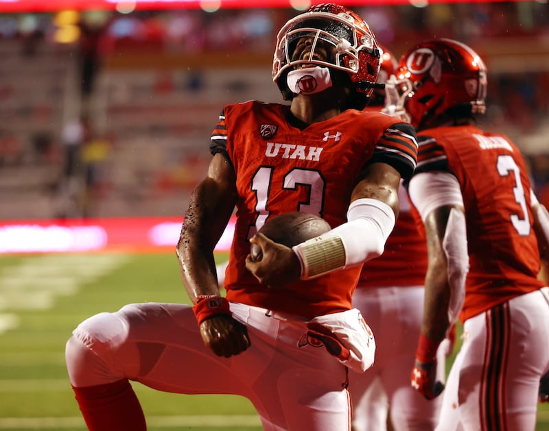 Utah Utes running back Nate Johnson (13) celebrates a touchdown as Utah and Arizona play at Rice-Eccles Stadium in Salt Lake City on Saturday, Nov. 5, 2022.