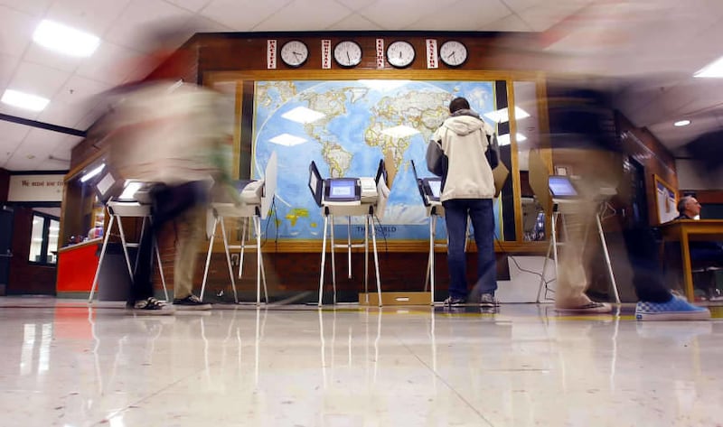 Brian McCarrey casts his vote at Bryant Middle School in Salt Lake City Tuesday, Nov. 8, 2011.