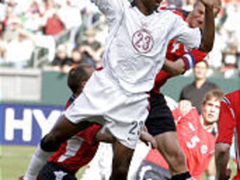 United States' Eddie Pope, left, and Norway's Brede Hangeland go up for a header during a recent match.
