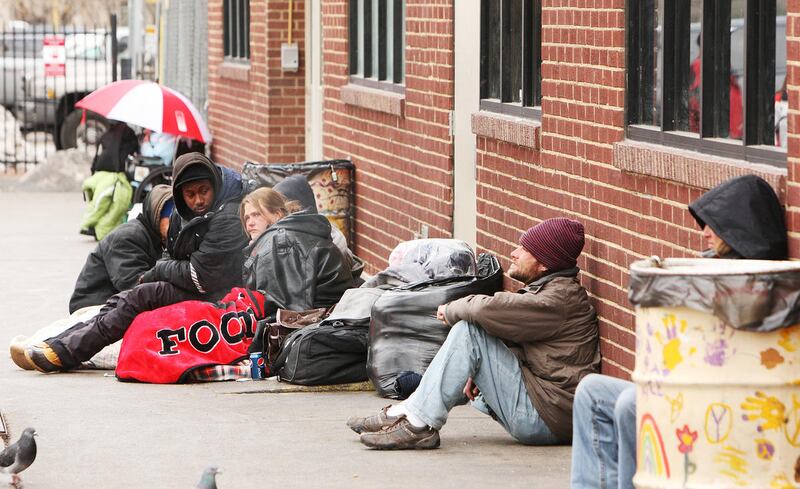 FILE — Homeless persons congregate outside the Road Home shelter in Salt Lake City Wednesday, Jan. 29, 2014. Homelessness in Utah is a statewide issue and ought not be the responsibility of one municipality or one county, Jackie Biskupski, the likely fu