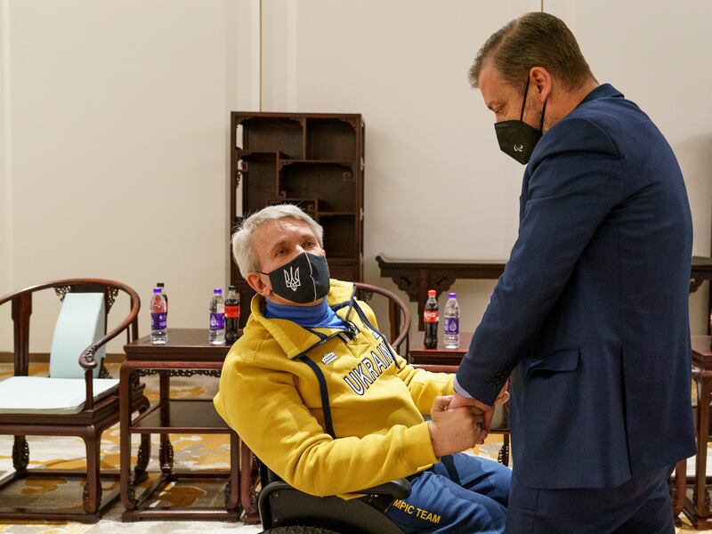 Valerii Sushkevych, president of the Ukraine National Paralympic Committee shakes hands with Andrew Parsons, president of the International Paralympic Committee.