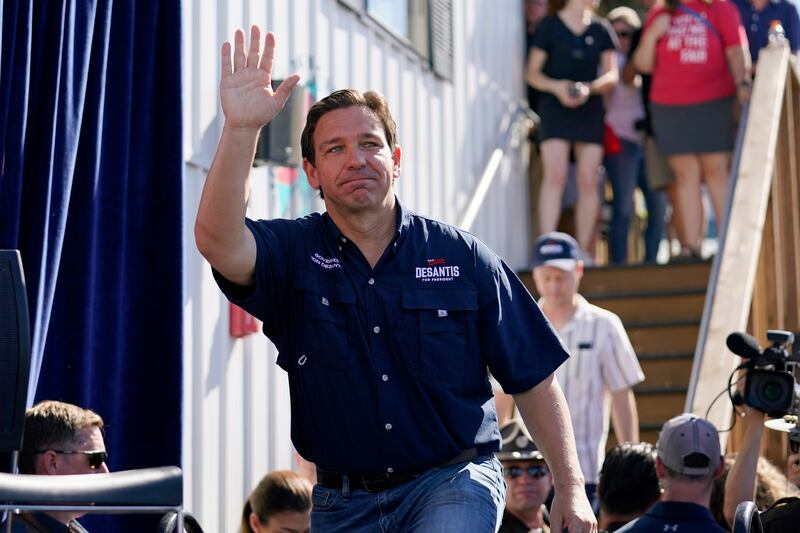 Republican presidential candidate Florida Gov. Ron DeSantis waves as he steps onto the stage for a Fair-Side Chat with Iowa Gov. Kim Reynolds at the Iowa State Fair, Saturday, Aug. 12, 2023, in Des Moines, Iowa.