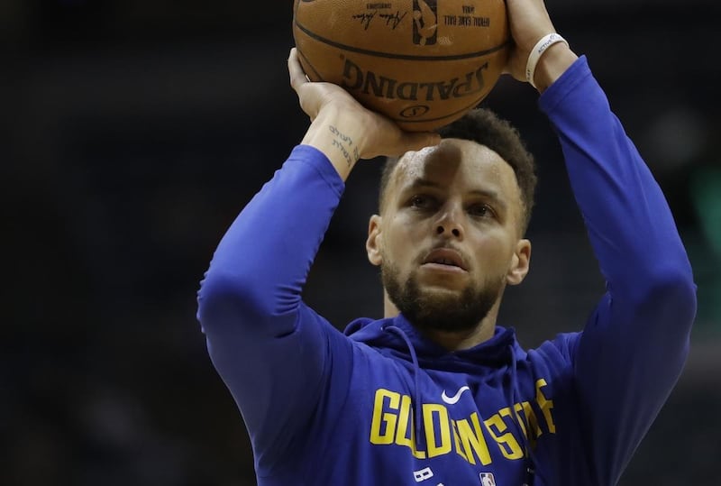 FILE: Golden State Warriors' Stephen Curry shoots before an NBA basketball game against the Milwaukee Bucks Friday, Jan. 12, 2018, in Milwaukee. (AP Photo/Morry Gash)