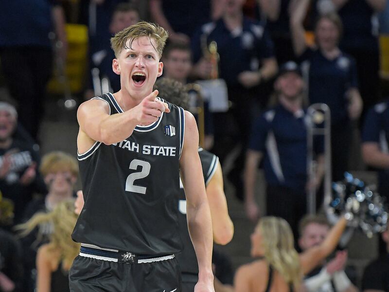 Utah State guard Sean Bairstow celebrates after making a basket against UNLV Tuesday, Jan. 17, 2023, in Logan.