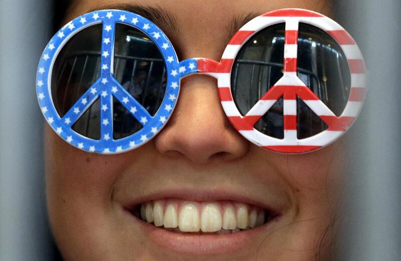 Natalie Cardemas smiles as she waits for Democratic presidential candidate, Sen. Bernie Sanders’s campaign stop at the Grand Theatre on Sunday, April 3, 2016, in Wausau, Wis.
