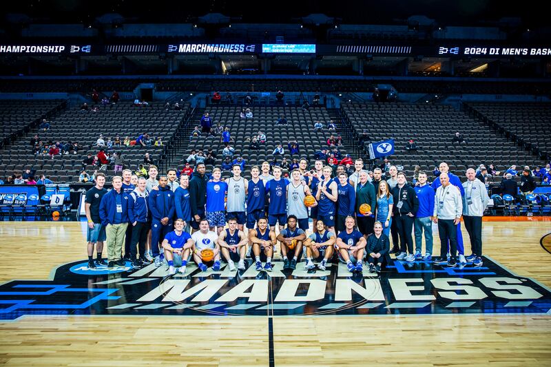 BYU players and staff pose for a picture at CHI Health Center Arena in Omaha, Neb., Wednesday, March 20, 2024.