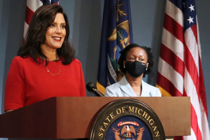 In this photo Sept. 16, 2020 file photo, provided by the Michigan Office of the Governor, Gov. Whitmer addresses the state during a speech in Lansing, Mich. According to a criminal complaint unsealed Thursday, Oct. 8 six people plotted to try to kidnap Whitmer at her vacation home.