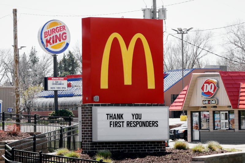 Burger King, Dairy Queen and McDonalds fast food restaurants on the same block in Omaha, Neb., Wednesday, April 15, 2020. (AP Photo/Nati Harnik)