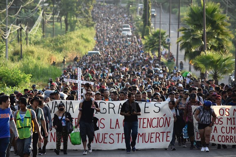 Migrants leave Tapachula, Mexico, Monday, Oct. 30, 2023, as they make their way to the U.S. border.
