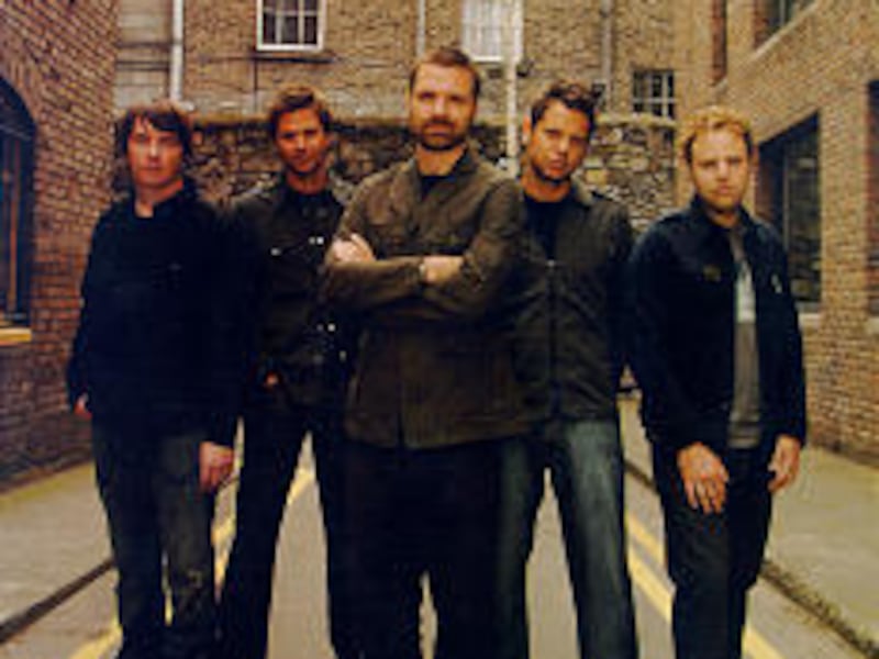 Mark Lee, left, Brad Avery, Mac Powell, Tai Anderson and David Carr of Third Day, performing Sunday evening at Abravanel Hall.