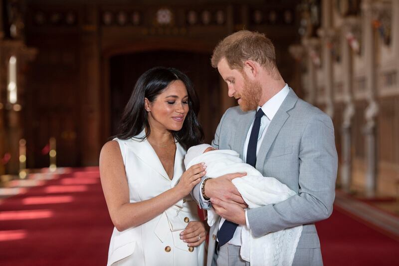 Britain’s Prince Harry and Meghan, Duchess of Sussex, pose during a photocall with newborn son Archie.
