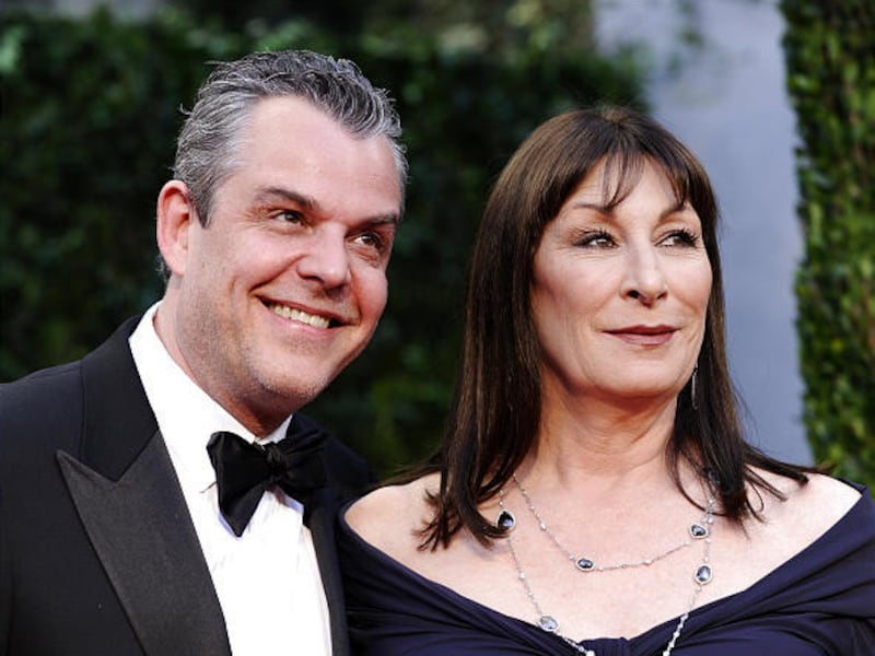 Danny Huston and Anjelica Huston arrive at an Oscar gala.