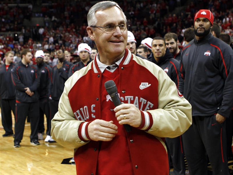 FILE - This Dec. 5, 2009, file photo shows Ohio State football coach Jim Tressel smiling as he addresses the crowd as his Big Ten champion football team was recognized at halftime of the Ohio State-Eastern Michigan NCAA college basketball game, in Columb