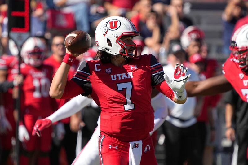 Utah quarterback Cameron Rising throws