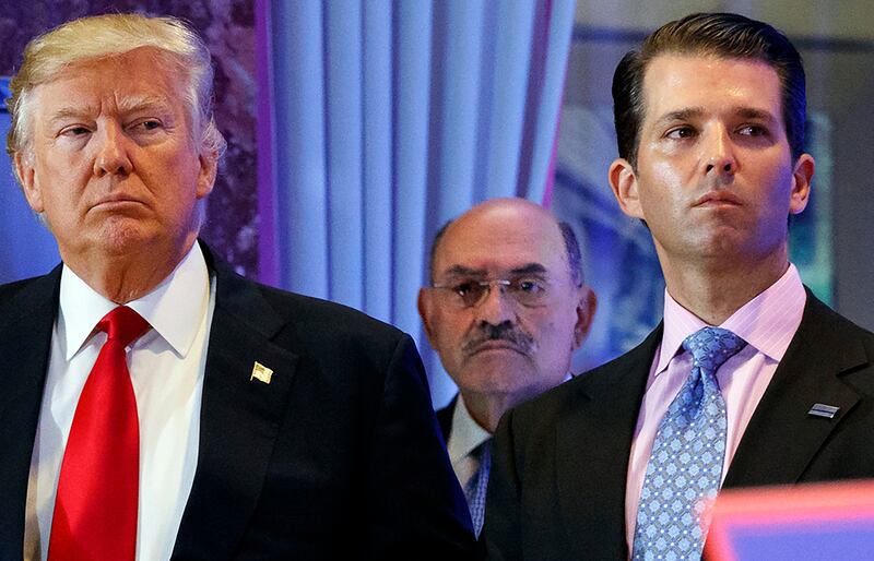 Donald Trump, left, his chief financial officer Allen Weisselberg, center, and his son Donald Trump Jr., right, attend a news conference at Trump Tower in New York
