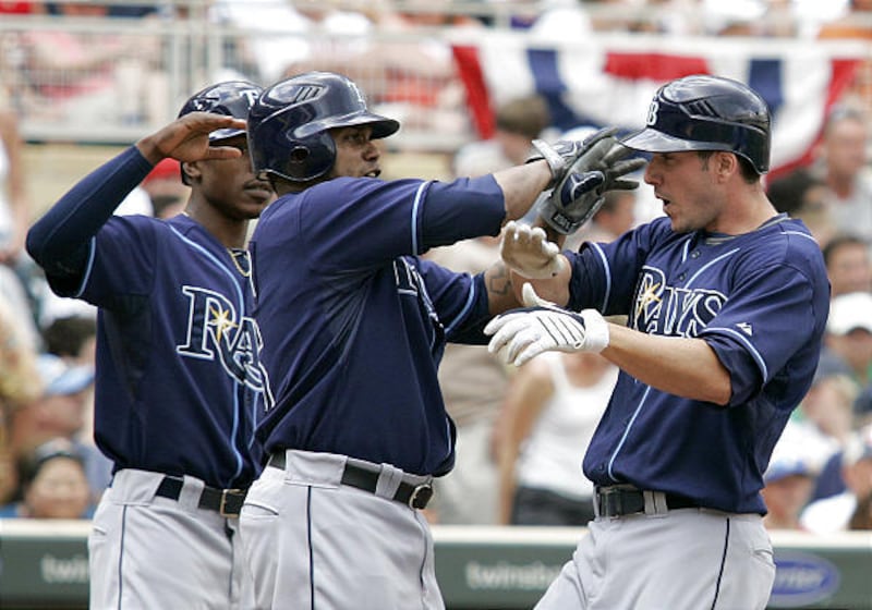 Tampa Bay's Matt Joyce is congratulated by teammates after his grand slam home run.