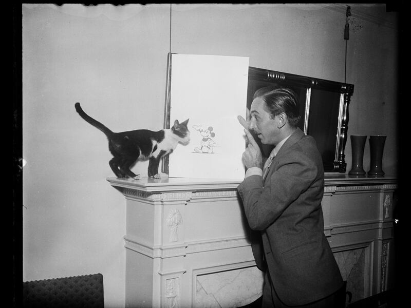 Walt Disney with a Mickey Mouse drawing from 1931.