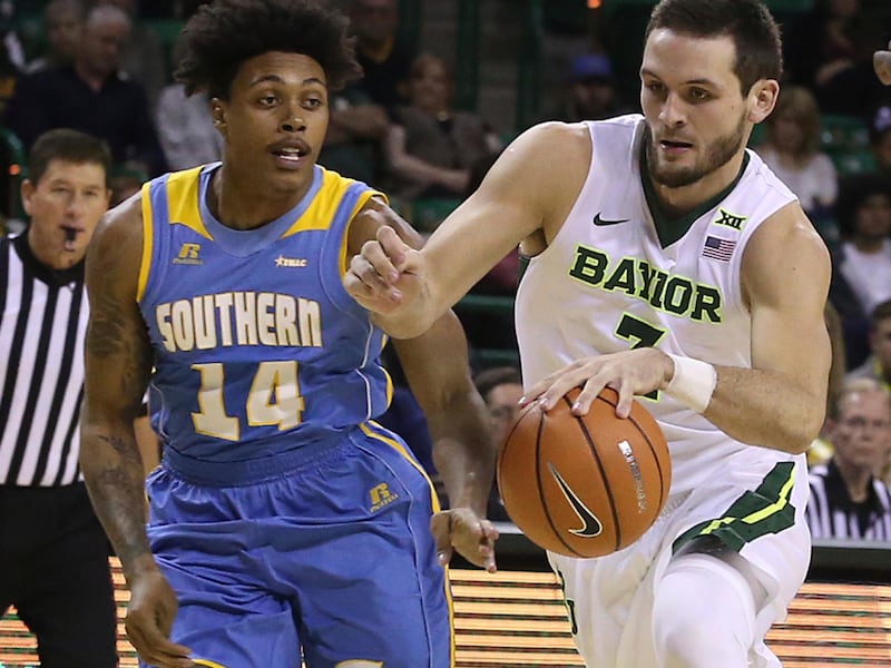 Baylor guard Jake Lindsey (3) takes the ball up court against Southern University guard Aaron Ray (14) during the second half of an NCAA college basketball game Wednesday, Dec. 20, 2017, in Waco, Texas. (AP Photo/Jerry Larson)