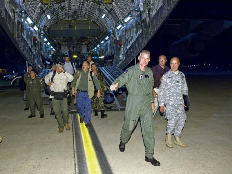 Keith Stansell, front, one of three U.S. military contractors who had been held hostage for more than five years by Colombian rebels, steps onto U.S. soil at Lackland Air Force Base, Texas, on Wednesday.