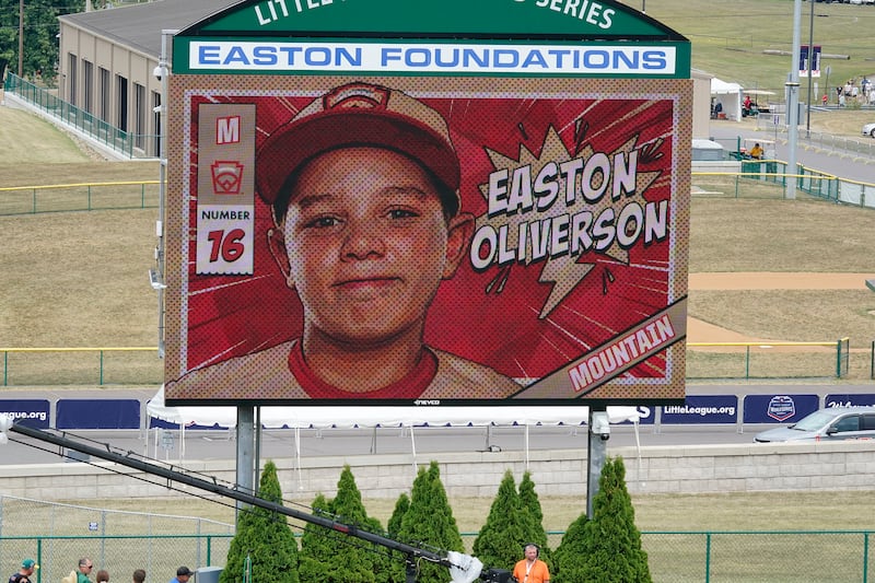 A picture of Snow Canyon Little League team member Easton Oliverson, from Santa Clara, Utah, is shown on the scoreboard at Volunteer Stadium during the opening ceremony of the 2022 Little League World Series.
