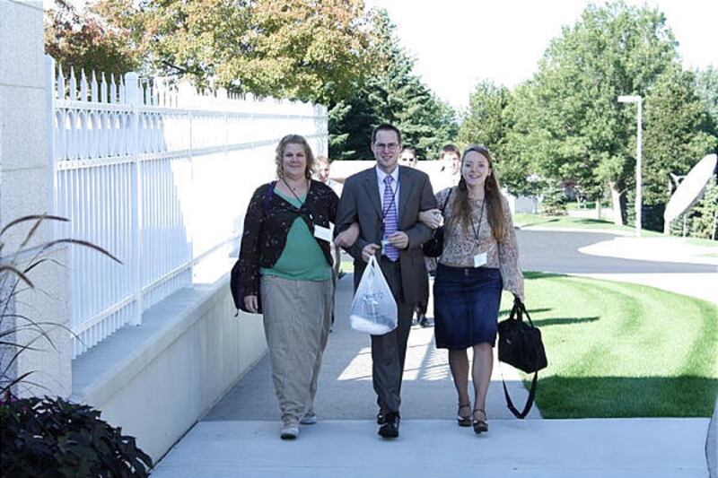 Colette Owen (Bismarck ND), Sterling Salter (Huron SD) and Rachel Atwood (Bismarck ND) walk from the Bismarck Stake Center to attend the Temple during the multistake YSA conference in North Dakota in September.